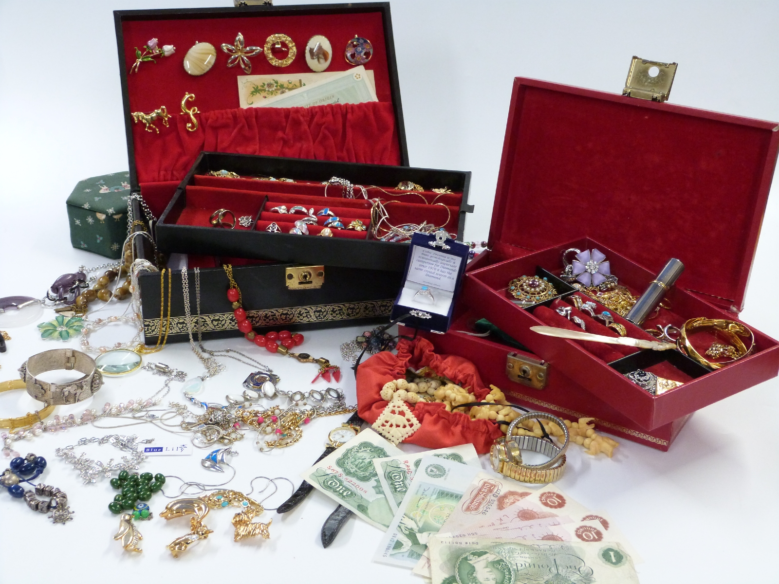A large collection of costume jewellery including silver rings, beads, silver necklaces, brooches,