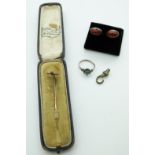 A 9ct gold stick pin in vintage Worcester jewellery box, silver ring and pressed amber earrings