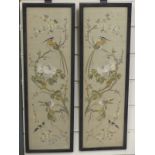 A framed pair of 19thC Chinese embroidered cuffs 54cm x 17cm