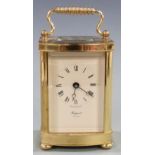 Twentieth century brass carriage clock by Rapport, London, with ivory coloured Roman dial and