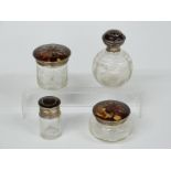 Set of four hallmarked silver and tortoiseshell pique work topped cut glass dressing table