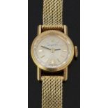 Dugena 18ct gold ladies wristwatch with black hands, gold baton markers, silver dial, bevelled bezel