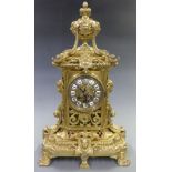 Nineteenth century brass mantel clock, ornate brass dial with cabouchon Roman numerals beetle and