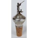Modern silver bottle stopper depicting a shooting scene with dog beside, height 10.5cm
