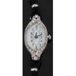 Art Deco platinum ladies cocktail wristwatch with diamond set case, black hands and Arabic numerals,