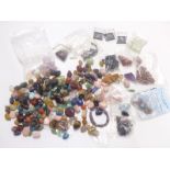 A collection of agate stones/ pebbles including amethyst, rose quartz, emerald etc