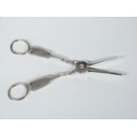 A pair of 19thC hallmarked silver fiddle and thread pattern grape scissors, marks indistinct but