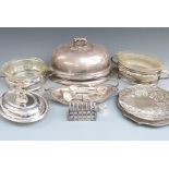 A quantity of silver plate including large meat dome, serving dishes, glass lined dishes, cutlery