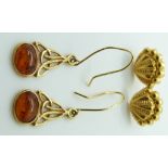 A pair of yellow metal earrings in the form of shells and a pair of 9ct gold earrings set with