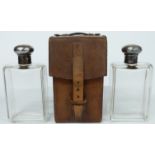 George V leather cased pair of hallmarked silver mounted glass flasks by J.G.Vickery, Regent St,