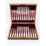 Cased set of mother of pearl handled hallmarked silver ferruled fruit knives and forks
