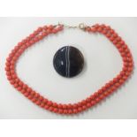 A double strand glass necklace made to look like coral with 9ct gold clasp and a Victorian banded