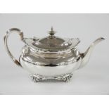 George V hallmarked silver teapot with shaped edge, raised on lion's paw feet, Sheffield 1921