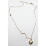 A 9ct gold chain and a 9ct gold heart locket, 6.7g