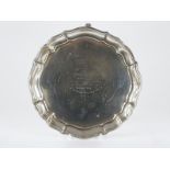 Elkington and Co George VI hallmarked silver card tray with a shaped edge and raised on three