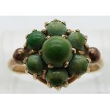 A 9ct gold ring set with a cluster of turquoise, size O