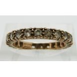 A 9ct gold eternity ring set with synthetic spinel, size L