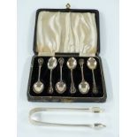 A cased set of six hallmarked silver teaspoons with pierced design, Birmingham 1944 together with