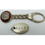 Two hallmarked silver keyrings/fobs, one with feature hallmarks, the other with applied St