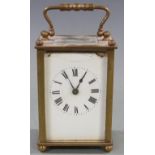 Late 19th/early 20thC French brass carriage clock, the white enamel Roman dial with spade hands,