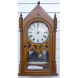 Nineteenth century probably American wall clock in Oak steeple style case. Thew pattern Roman dial