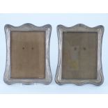 A pair of George V hallmarked silver photograph frames to suit 8 x 6in photo, Birmingham 1918