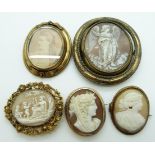 Three Victorian pinchbeck cameo brooches, Victorian swivel brooch and a yellow metal brooch set with