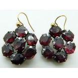 A pair of Victorian earrings set with foiled oval garnets