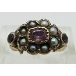 An early Victorian ring set with foiled amethysts and pearls, size N