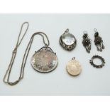 A mounted Maria Theresia coin, a silver necklace, a pair of filigree earrings, a Victorian locket, a