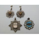 A pair of silver earrings converted from fobs verso engraved Steeplechase Weymouth College,with a