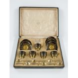 Cased George V Royal Worcester coffee service with six hallmarked silver gilt spoons, London 1921