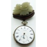 A silver pocket watch by S.J.Bartlett and jadeite carving