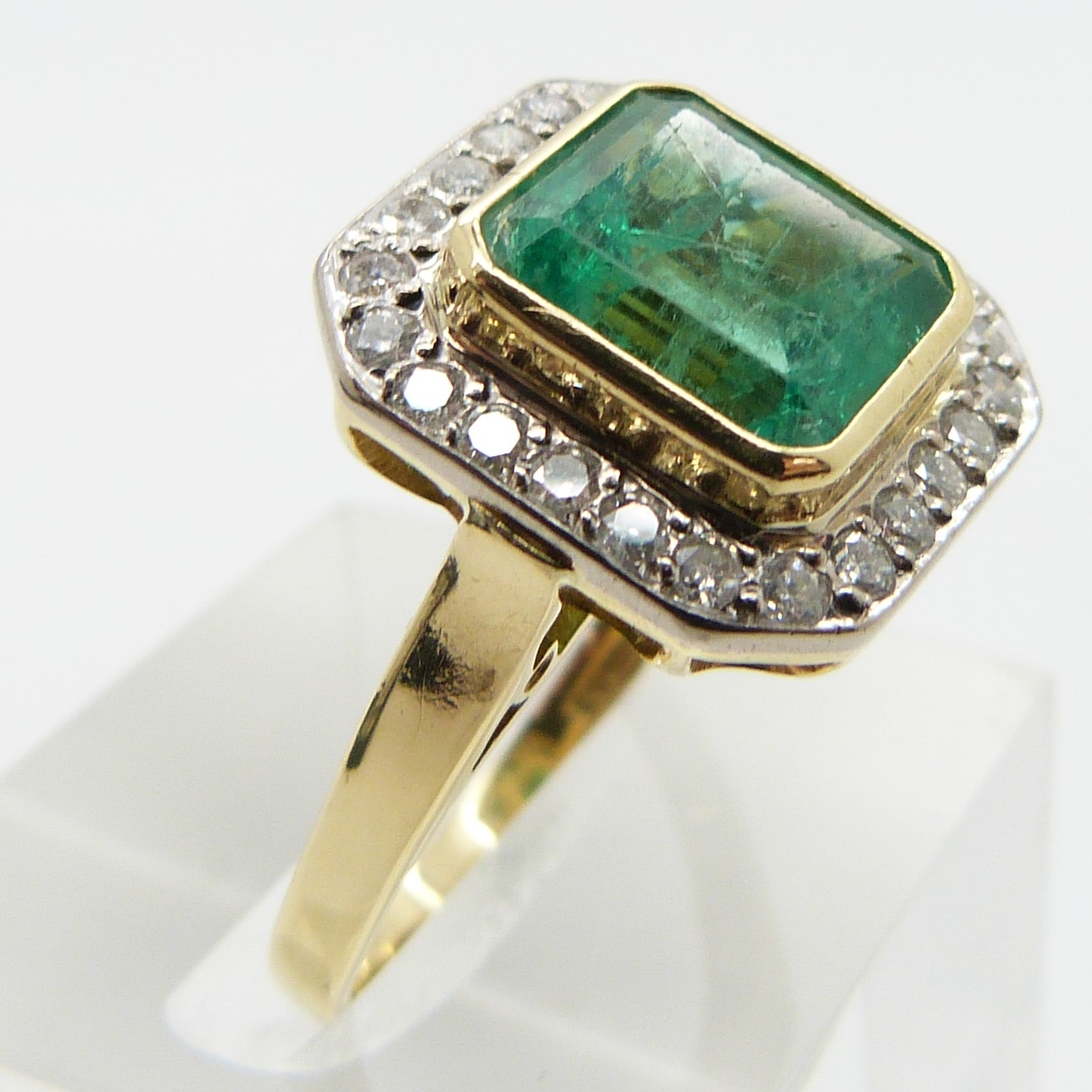 An 18ct gold ring set with an emerald cut emerald approximately 3.3ct surround by diamonds, size N - Image 3 of 3