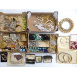 A collection of costume jewellery including gold toned jewellery, white metal pendant, silver
