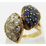 An 18ct gold ring set with diamonds and sapphires in two sections, the largest two stones