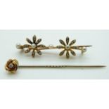 Edwardian brooch set with seed pearls in a floral design and a 15ct gold stick pin set with a