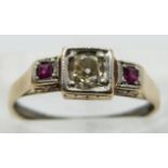 Art Deco ring set with an old cut diamond of approximately 0.3ct and two rubies, size K