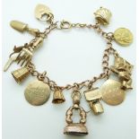 A 9ct gold charm bracelet with 11 charms including seal, kangaroo, cherub, shell, St Christopher