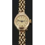 Excalibur 9ct gold ladies wristwatch with black hands, two-tone baton markers, gold dial and 17