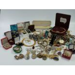 A large collection of costume jewellery including pearl bracelet, silver ring, brooches,