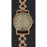 Britix 18ct gold ladies wristwatch with gold hands and hour markers and champagne dial, on 9ct