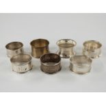 Seven various hallmarked silver napkin rings, 94g