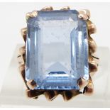 A 9ct gold ring set with an emerald cut blue synthetic spinel , size K