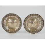 A pair of Victorian hallmarked silver pierced and embossed bonbon dishes, one Chester 1896 maker