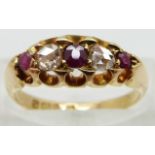 An 18ct gold ring set with rose cut diamonds and three rubies, Chester 1904, size M