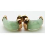 A pair of gold earrings set with jadeite