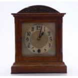 Oak cased mantel clock c1930, the silvered Arabic dial with spade hands, 25cm tall.