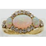 Edwardian 18ct gold ring set with three opal cabochons and diamonds, Birmingham 1904, maker Pepper