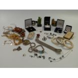 A collection of silver jewellery including bangles, necklace, bracelet, locket, citrine necklace and